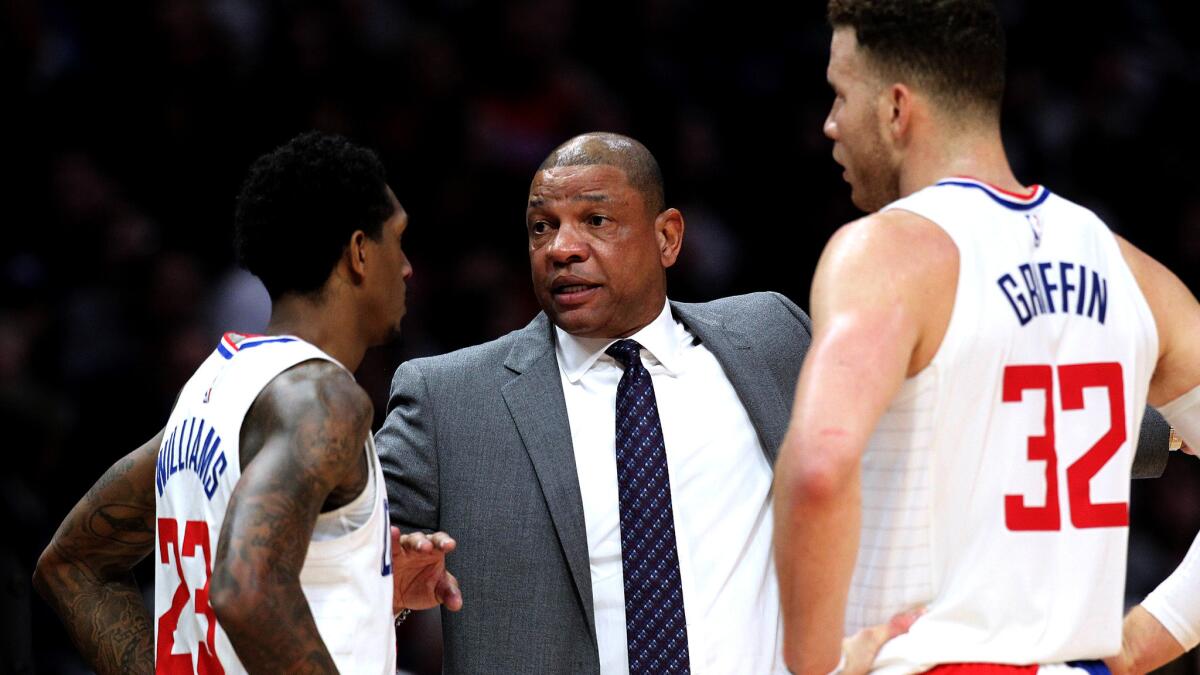 “It’s a fun team, man,’’ said the Clippers' Blake Griffin, right, shown with coach Doc Rivers and veteran guard Lou Williams during a game earlier this season at Staples Center.