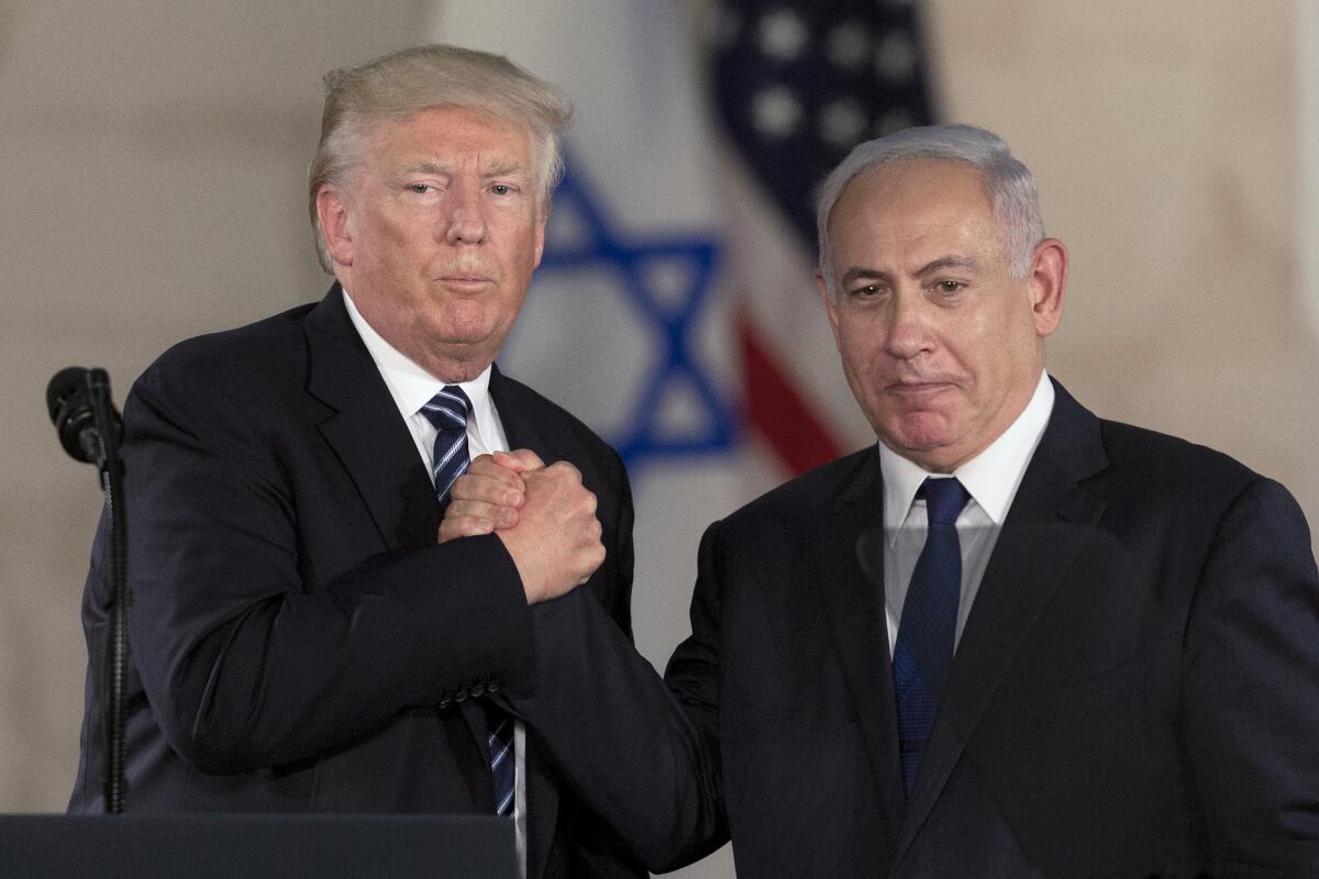 President Trump and Israeli Prime Minister Benjamin Netanyahu shake hands in May.