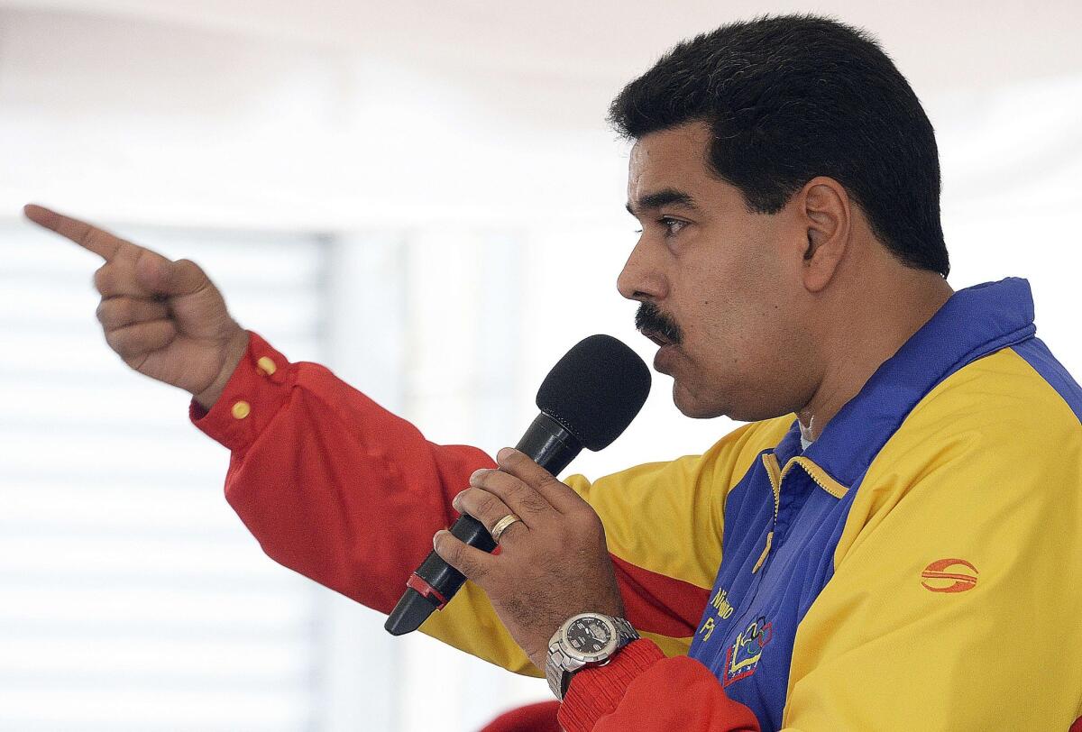 Venezuelan President Nicolas Maduro speaks of his plans to implement an air defense system during a meeting in the shantytown of Petare in Caracas.