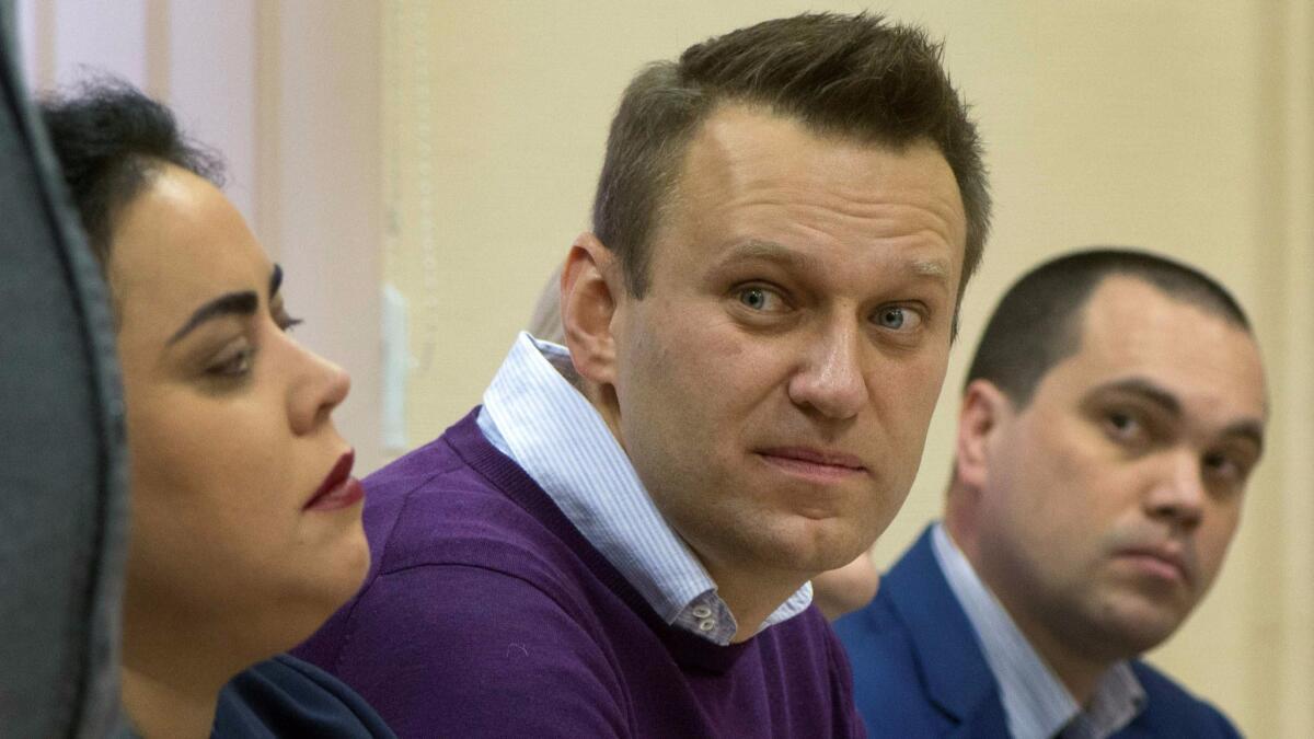Russian opposition leader Alexei Navalny listens during a Dec. 5 court hearing in Kirov.