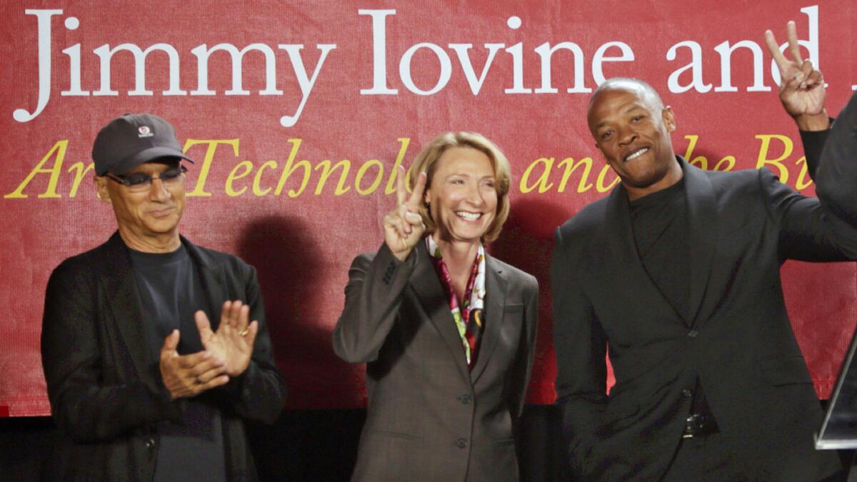 Roski Dean Erica Muhl with Jimmy Iovine and Dr. Dre at the opening of the Jimmy Iovine and Andre Young Academy for Arts and Technology and Business Innovation in 2013.