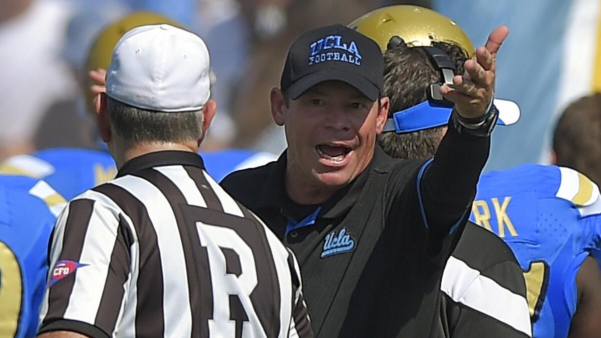 UCLA Coach Jim Mora argues with an official during the Bruins' loss to Oregon on Oct. 11.