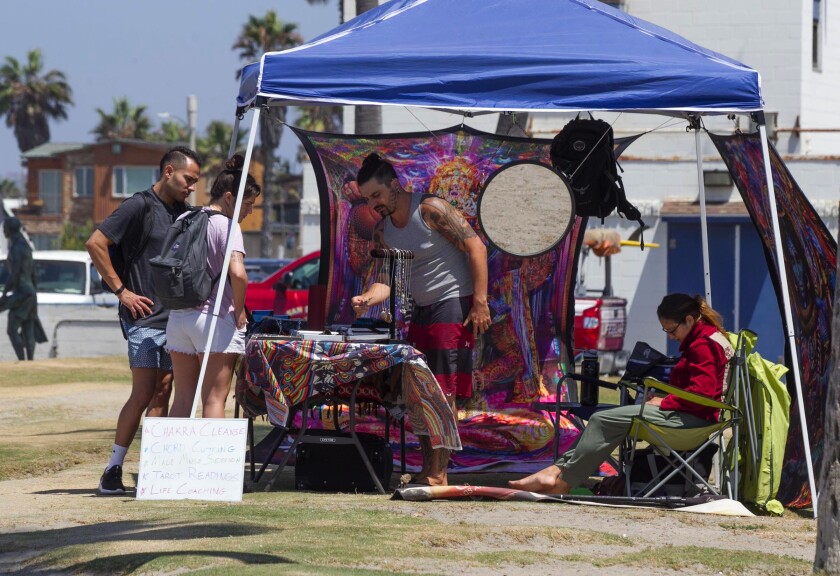 Streetside vendors sell their wares in Ocean Beach in 2019.