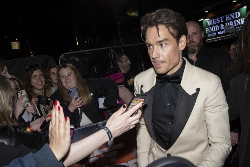 Liam Payne interacts with fans upon arrival at the premiere of the film 'All of Those Voices' in London Thursday, March 16, 2023. (Photo by Vianney Le Caer/Invision/AP)