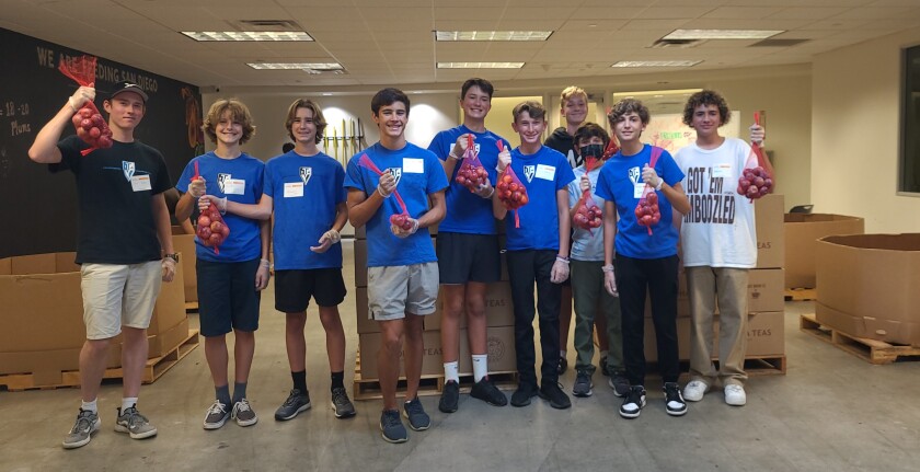 TVIA boys helped package 2,500 pounds of plums in 2021 for Feeding San Diego.