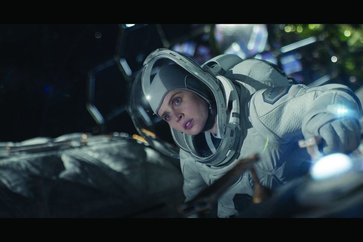 Felicity Jones as an astronaut on a spacewalk in "The Midnight Sky"