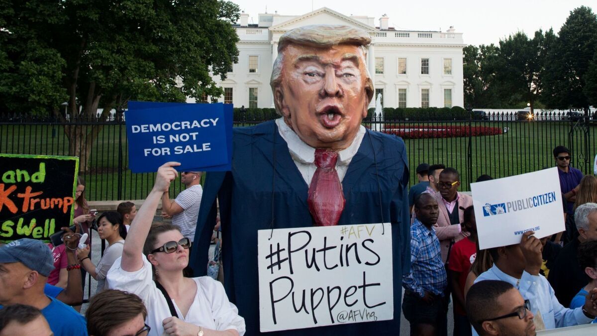 Protesters participate in a vigil "to demand democracy" outside the White House on July 18.