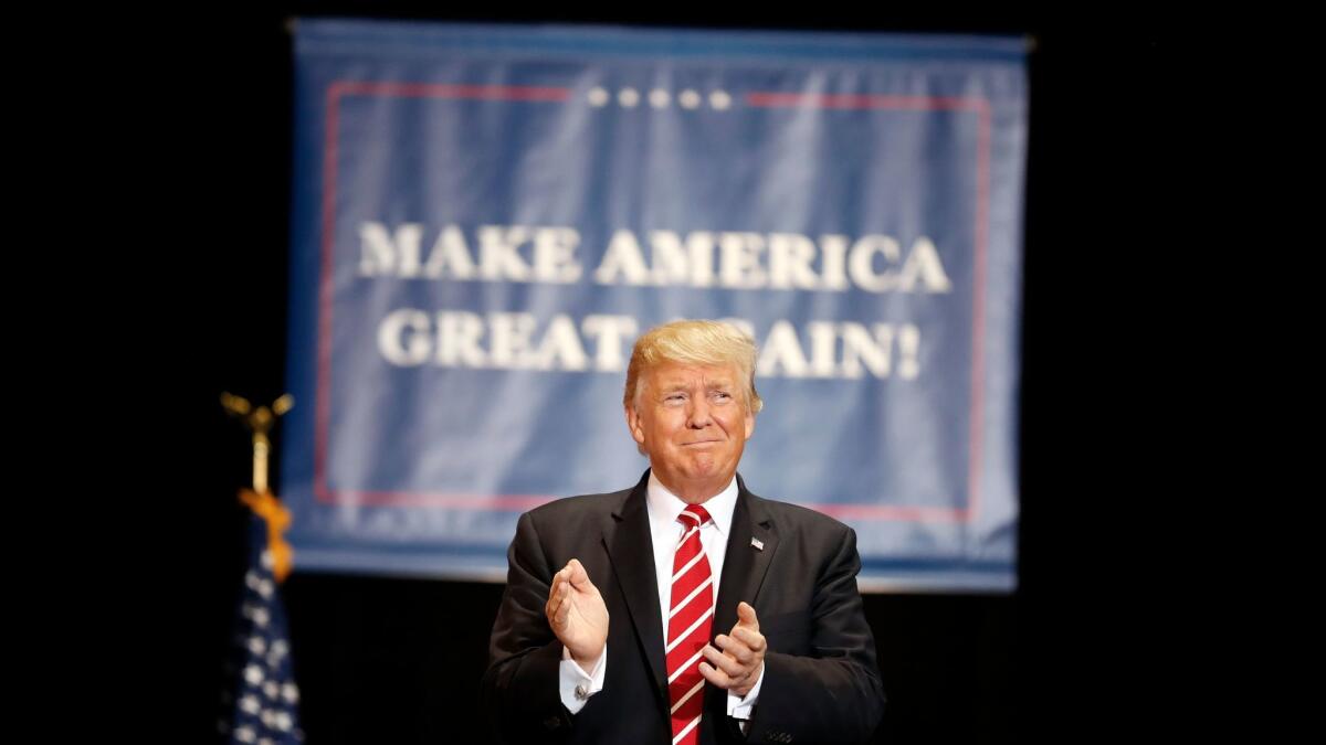 President Trump arrives at a rally at the Phoenix Convention Center on Aug. 22.