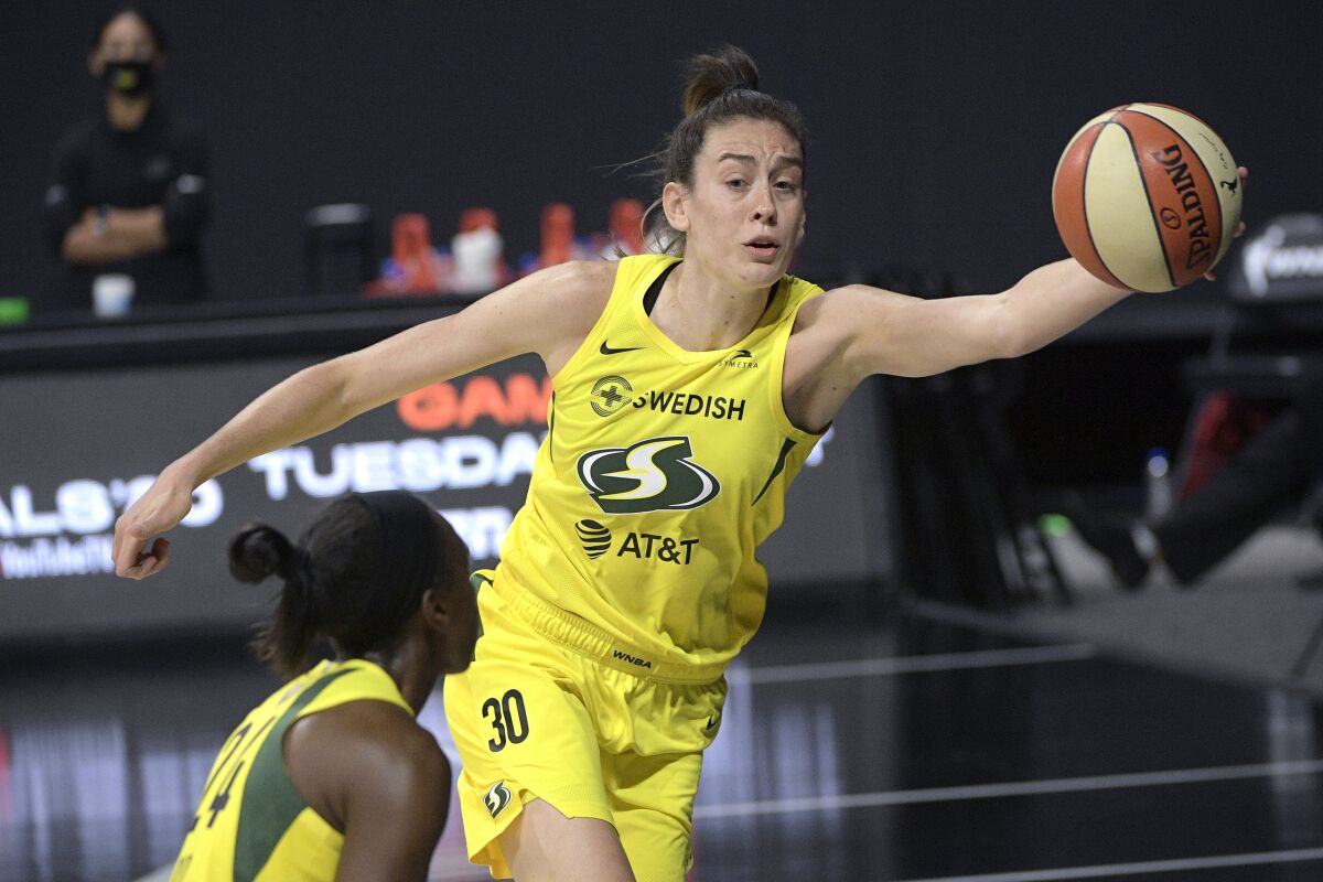 Seattle forward Breanna Stewart saves a ball from going out of bounds by tipping it to guard Jewell Loyd.
