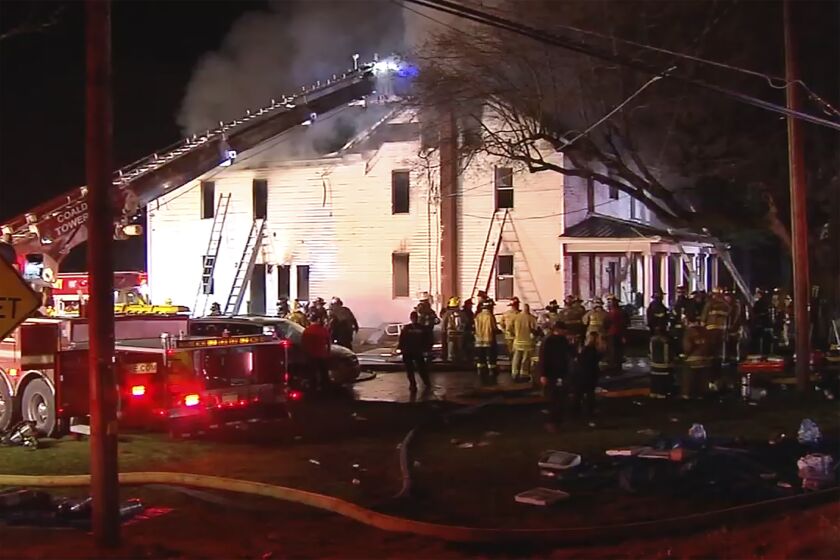 Firefighters work on the scene of a house fire Wednesday, Dec. 7, 2022, in West Penn Township, west of Allentown, Pa. Pennsylvania State Police say two firefighters died responding to the blaze where a body was found, while two people who lived in the home got out safely. (WFMZ-TV via AP)