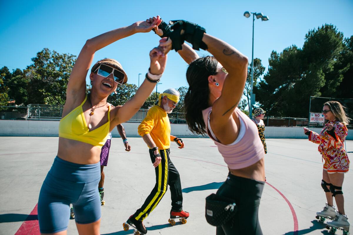 Several people at an outdoor skating rink