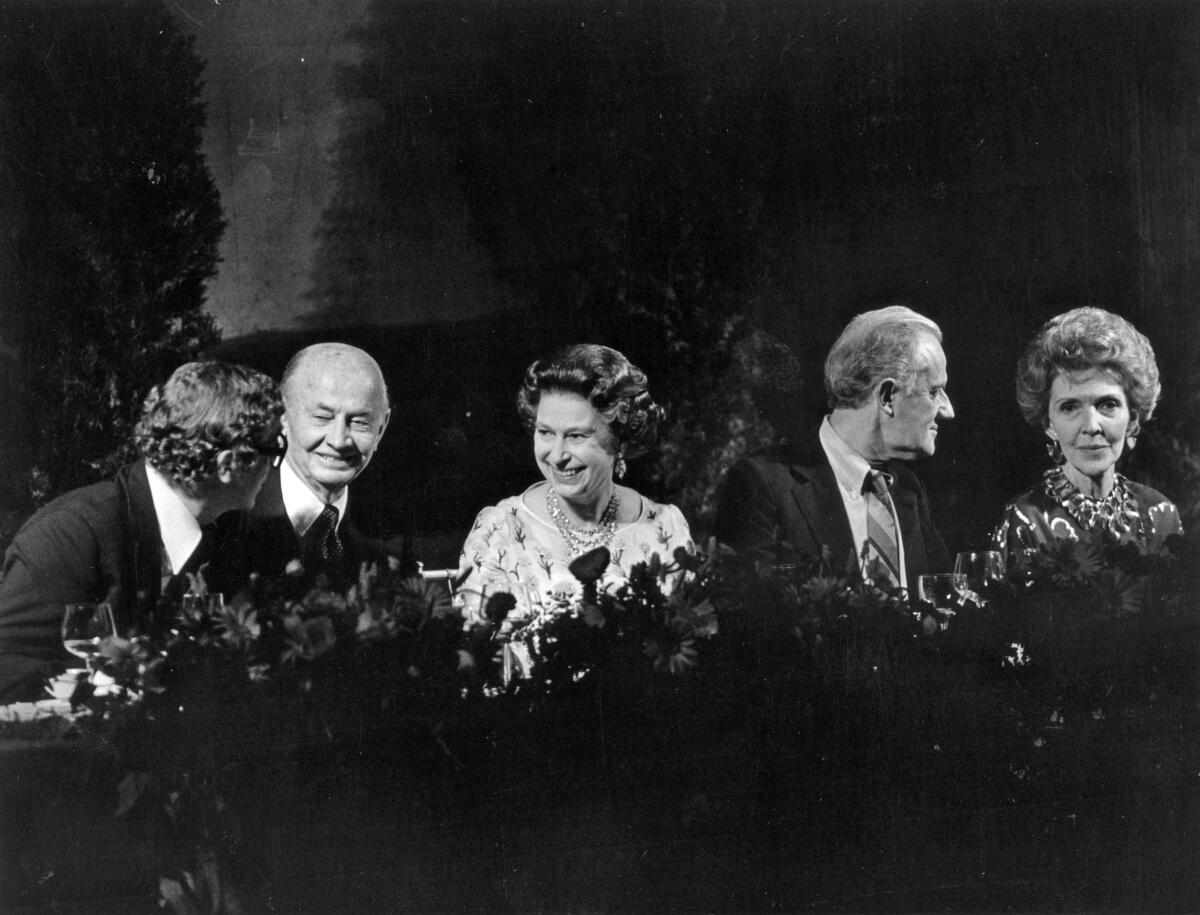 Queen Elizabeth II with Michael Caine, Tony Richardson and Nancy Reagan during a 1983 banquet at 20th Century Fox.