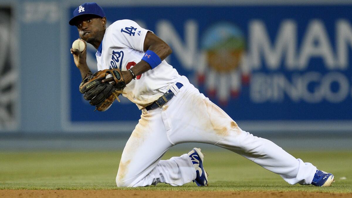 Dodgers second baseman Dee Gordon throws from his knees during a game against the Chicago White Sox in June. Gordon was named a National League All-Star for the first time Sunday.