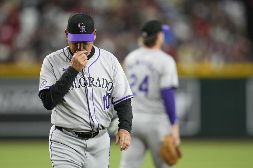 Colorado Rockies manager Bud Black walks off the field after replacing a pitcher during the third inning of the team's baseball game against the Arizona Diamondbacks on Thursday, March 28, 2024, in Phoenix. The Diamondbacks won 16-1. (AP Photo/Ross D. Franklin)