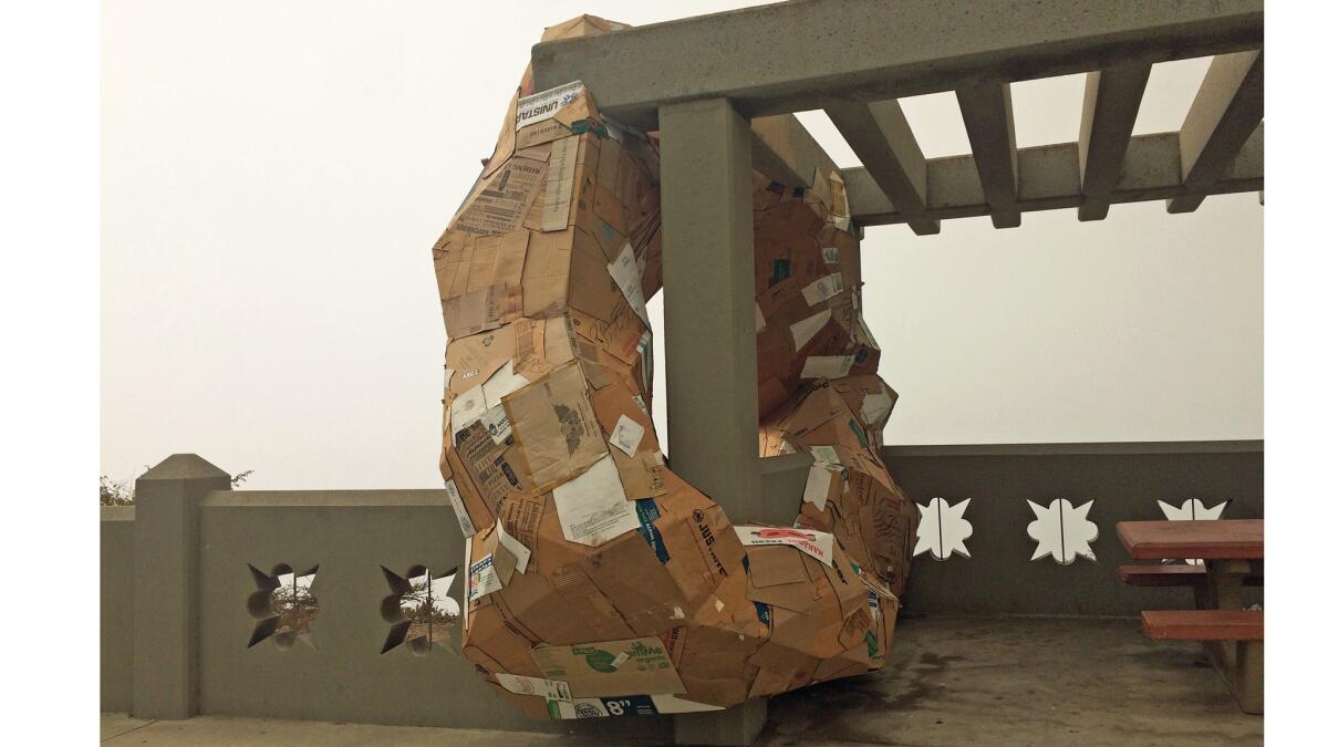 The side view of Michael Parker's "Ides," a sculpture made of cardboard installed in San Pedro.