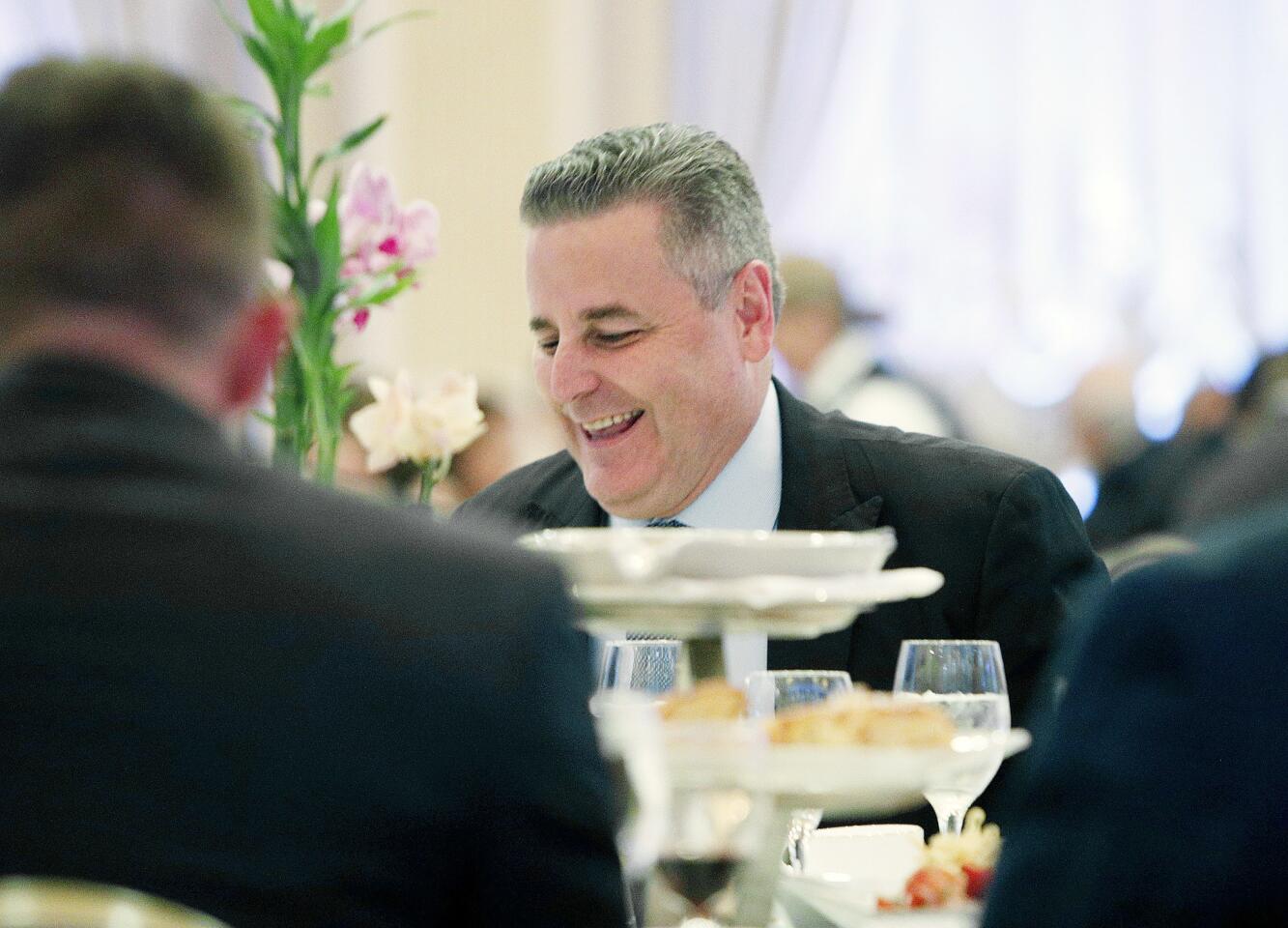 Glendale Fire Chief Greg Fish laughs as he is talked about at his retirement dinner at the Renaissance Banquet hall in Glendale on Wednesday, September 19, 2018. Chief Fish is retiring after 31 years with the department to take a job at the fire department in Carpinteria.