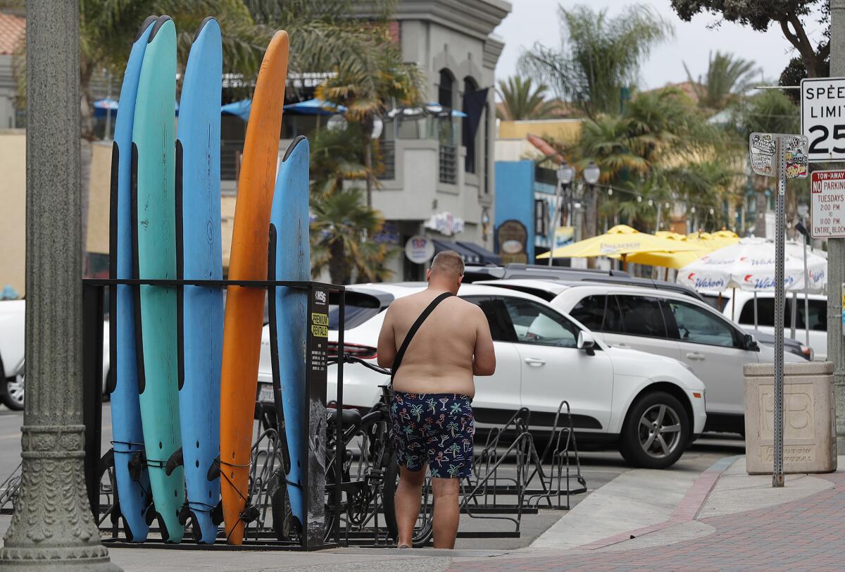 Rental surfboards on Main Street in downtown Huntington Beach on Thursday.