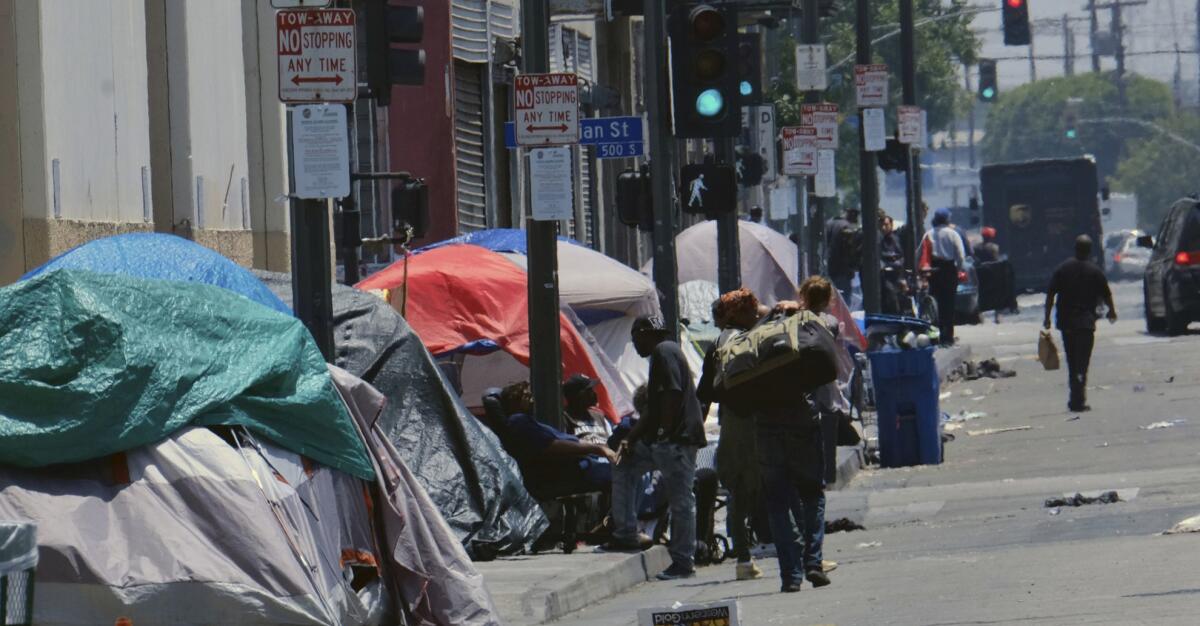 Tents for the homeless line a street in downtown Los Angeles.