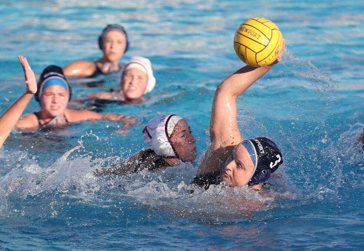 Newport Harbor's Ryan Chalupnik (3) makes a move at center and scores against Laguna Beach in a December match.