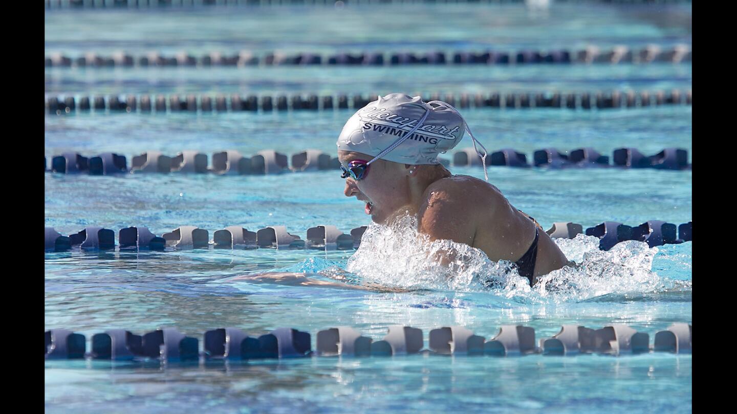 Newport's Carly Yiasko swims the girls varsity 200 IM breast stroke during the Battle of the Bay swim meet against Corona Del Mar on Thursday.