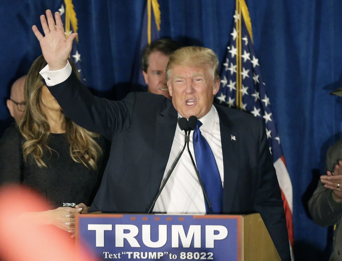 Republican presidential candidate Donald Trump waves to supporters during a primary night rally on Tuesday. After his win in New Hampshire, the road to the nomination gets more difficult.