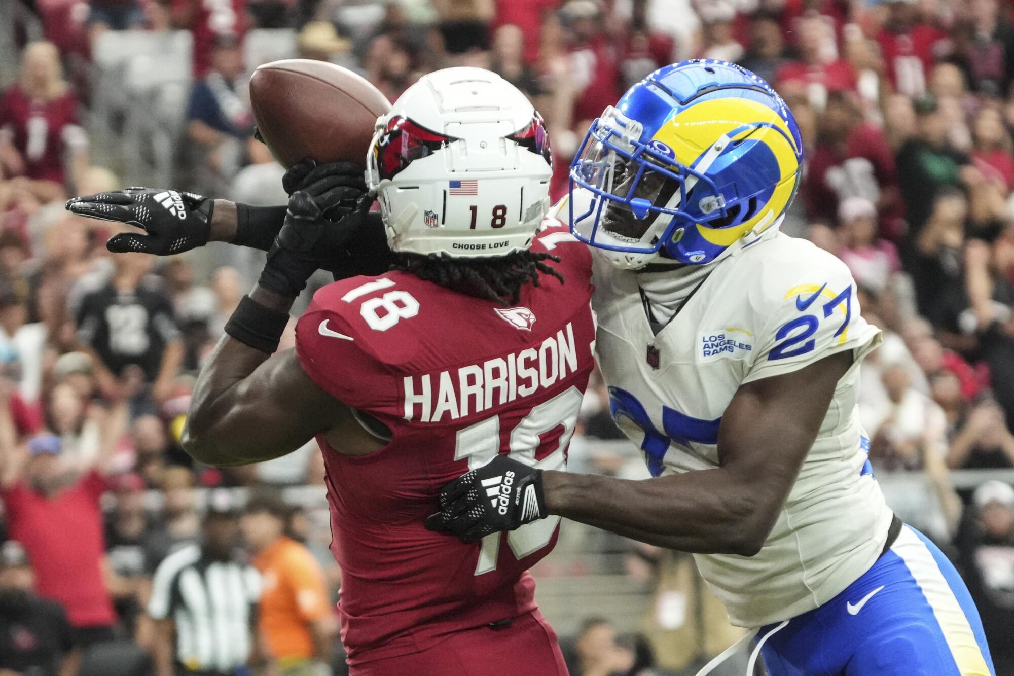 Arizona Cardinals wide receiver Marvin Harrison Jr. makes a touchdown catch over Rams cornerback Tre'Davious White.