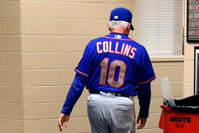 New York Mets manager Terry Collins walks from his office after resigning as manager following a game against the Philadelphia Phillies, Sunday, Oct. 1, 2017, in Philadelphia. New York Mets manager Terry Collins resigned Sunday and will take a position in the team's front office. Collins announced the move after the Mets lost to Philadelphia 11-0 to finish the season. (AP Photo/Derik Hamilton)