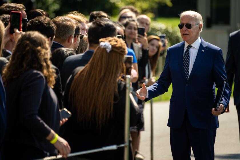 WASHINGTON, DC - AUGUST 24: President Joe Biden greets guests after disembarking from Marine One, returning to the White House from Rehoboth, Delaware, on the South Lawn of the White House on Wednesday, Aug. 24, 2022 in Washington, DC. (Kent Nishimura / Los Angeles Times)