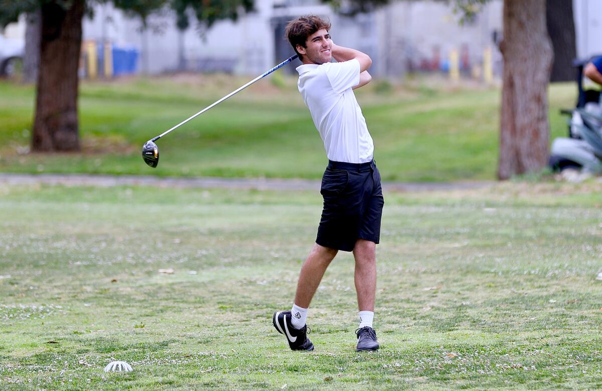 Palisades’ Luke Schultz follows through on his tee shot in Wednesday’s playoff to decide the City golf championship.