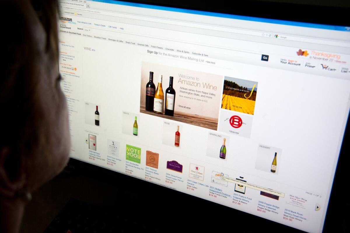 A woman shops for wine on Amazon's site in Washington, D.C.