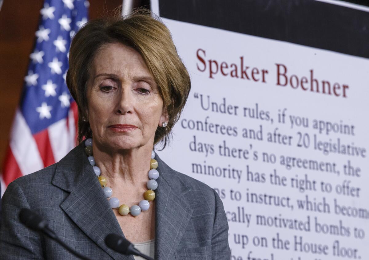 House Minority Leader Nancy Pelosi (D-San Francisco) attends a news conference at the Capitol.