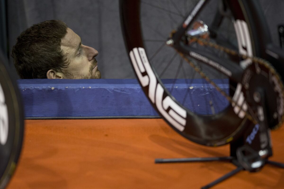 FILE - Former Tour de France winner and Olympic Gold medallist Britain's Bradley Wiggins relaxes after competing during the six day race at 't Kuipke velodrome in Ghent, Belgium, on Nov. 20, 2016. Former Tour de France champion Bradley Wiggins has revealed that he was sexually groomed by a coach when he was 13 years old. The five-time Olympic champion made the allegation in an interview with Men’s Health UK magazine. He did not identify the coach. (AP Photo/Peter Dejong)