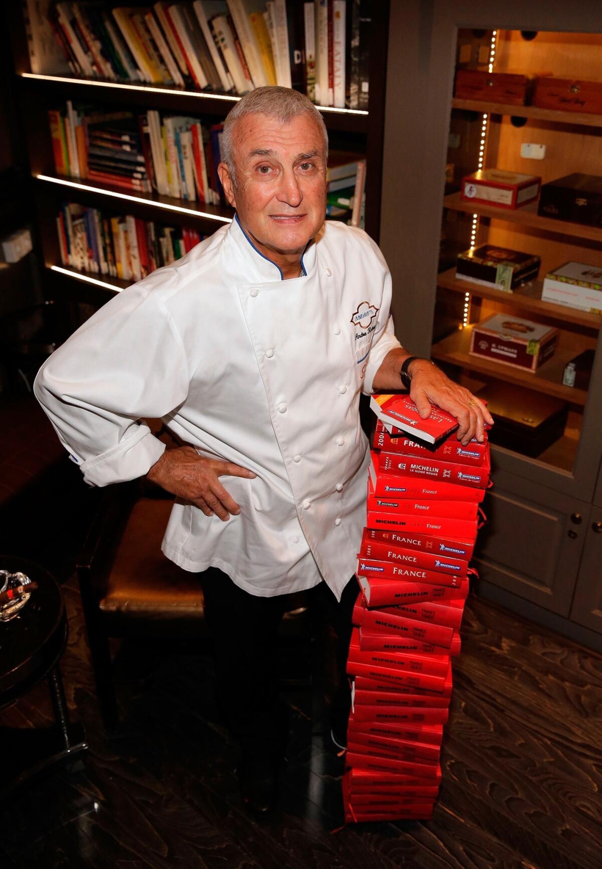 Andre Rochat stands in his new culinary library at Andre's Restaurant & Lounge at the Monte Carlo.