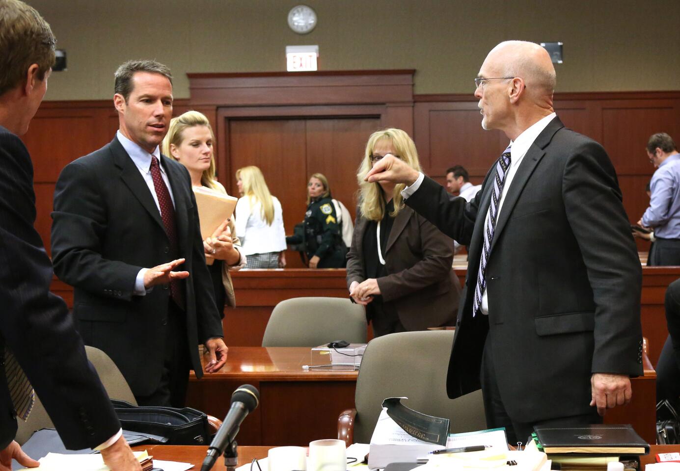 Defense counsel Don West addresses assistant state attorney John Guy after court recesses in the George Zimmerman trial in Seminole circuit court, in Sanford, Fla., late Tuesday night, July 9, 2013. Zimmerman is charged with 2nd-degree murder in the fatal shooting of Trayvon Martin, an unarmed teen, in 2012. (Joe Burbank/Orlando Sentinel/POOL) newsgate CCI B583047564Z.1