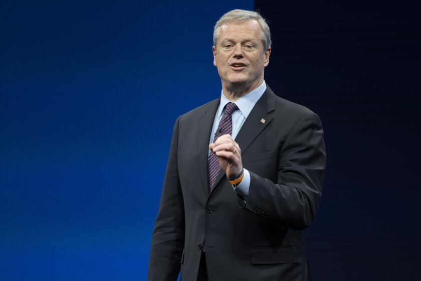 FILE - Incoming NCAA president Charlie Baker speaks during the NCAA Convention, Thursday, Jan. 12, 2023, in San Antonio. NCAA President Charlie Baker wants a federal law to regulate the way college athletes can be compensated for name, image and likeness that creates a registry of deals, agent certification and uniform contract standards. (AP Photo/Darren Abate, File)