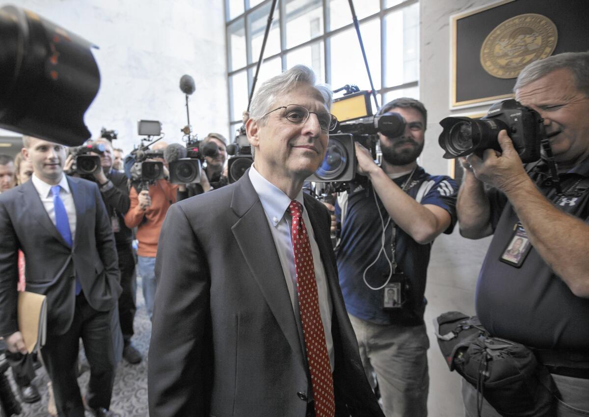 Supreme Court nominee Merrick Garland en route to meet his first Republican senator, Mark Steven Kirk of Illinois, on Capitol Hill.