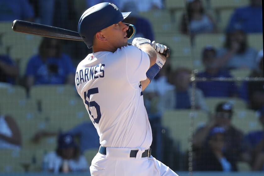 LOS ANGELES, CL;IF.- SEP. 20, 2022. Dodgers catcher Austin Barnes strokes a two-run homer in the eighth inning to spark a 6-5 comeback victory at home against the Diamondbacks on Tuesday, Sep . 20, 2022. (Luis Sinco / Los Angeles Times)