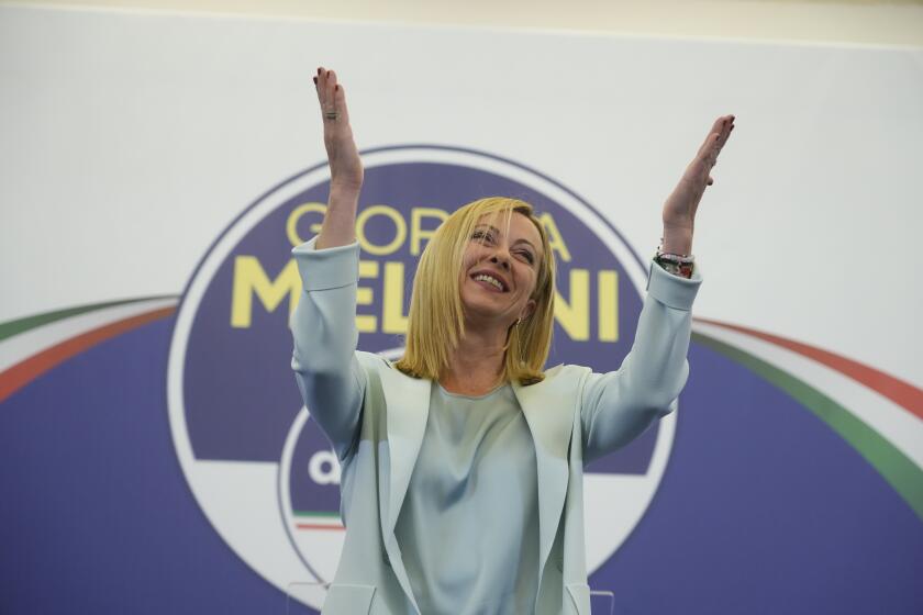 Far-Right party Brothers of Italy's leader Giorgia Meloni is cheered by supporters at her party's electoral headquarters in Rome, early Monday, Sept. 26, 2022. Italian voters rewarded Giorgia Meloni's euroskeptic party with neo-fascist roots, propelling the country toward what likely would be its first far-right-led government since World War II, based on partial results Monday from the election for Parliament. (AP Photo/Gregorio Borgia)