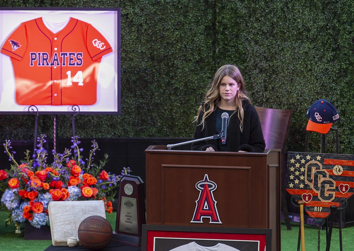 Alyssa Altobelli's friend Sammy Forbath speaks during Monday's memorial for Alyssa and her parents, John and Keri Altobelli, at Angel Stadium in Anaheim.