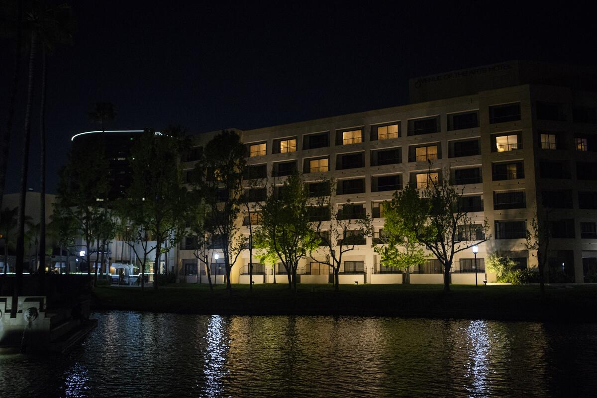 The Avenue of the Arts hotel in Costa Mesa lights windows in the shape of a heart on Tuesday.