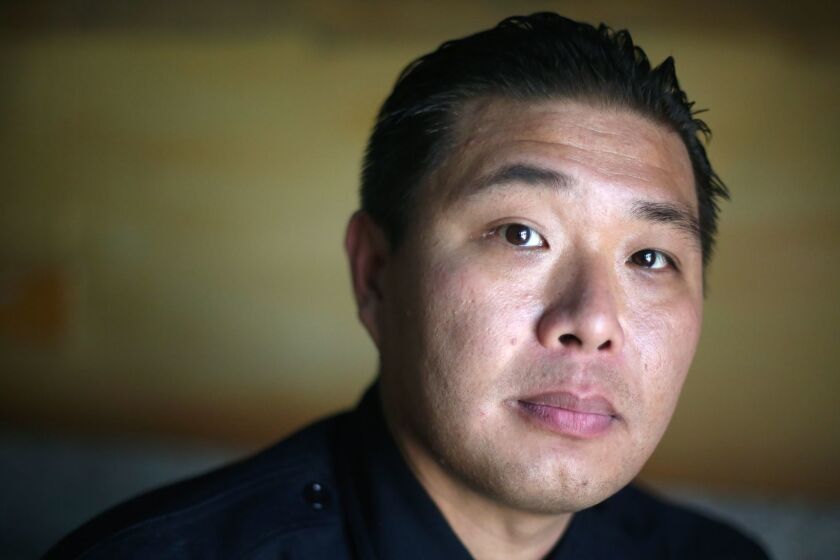 LOS ANGELES, CA-JUNE 6, 2019: Monterey Park Police officer Bob Hung poses for a portrait on June 6, 2019, in Los Angeles, California. His sister has a history with mental illness and mitigating her treatment is tricky. (Photo By Dania Maxwell / Los Angeles Times)