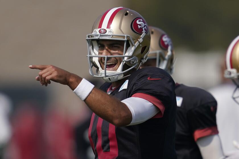 San Francisco 49ers quarterback Jimmy Garoppolo (10) gestures during NFL football practice.