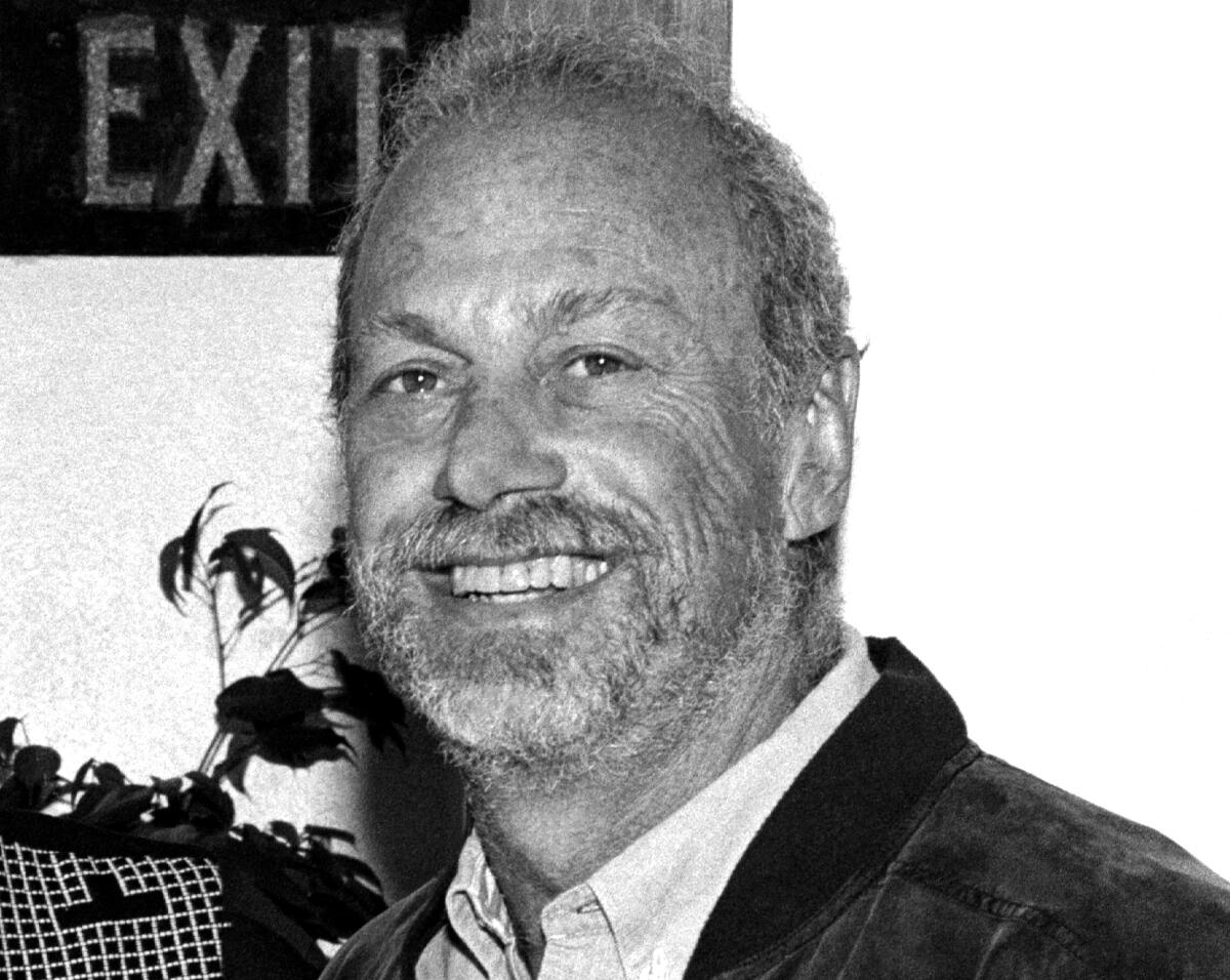 A black-and-white photo of Eddie Rosenblatt smiling.