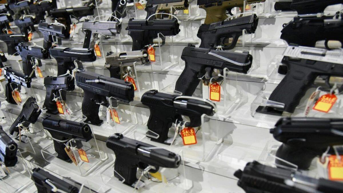 Handguns for sale are displayed at the South Florida Gun Show in Miami in 2018.