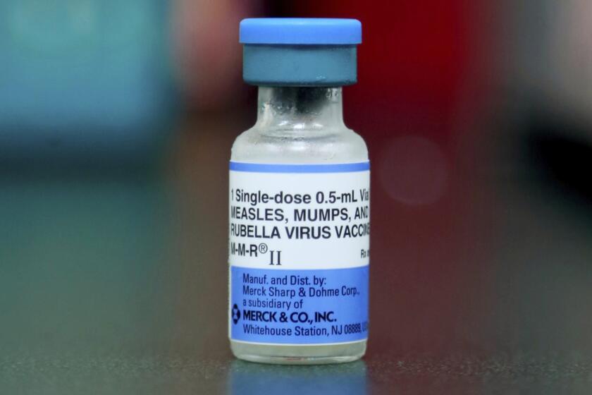 FILE - A vial of a measles, mumps and rubella vaccine is seen in Mount Vernon, Ohio, Friday, May 17, 2019. 