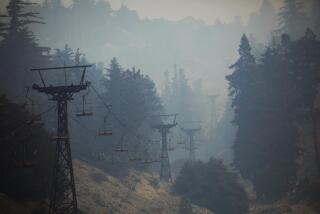 MOUNT BALDY, CA - SEPTEMBER 12, 2024 - The Mount Baldy ski lifts are shrouded in smoke from the Bridge fire in Mount Baldy on September 12, 2024. (Genaro Molina/Los Angeles Times)