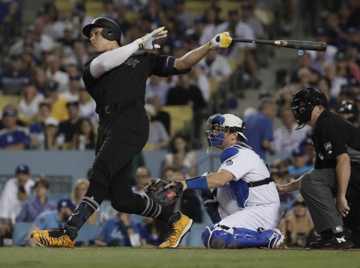 The Yankees' Aaron Judge homers at Dodger Stadium on Aug. 23, 2019.