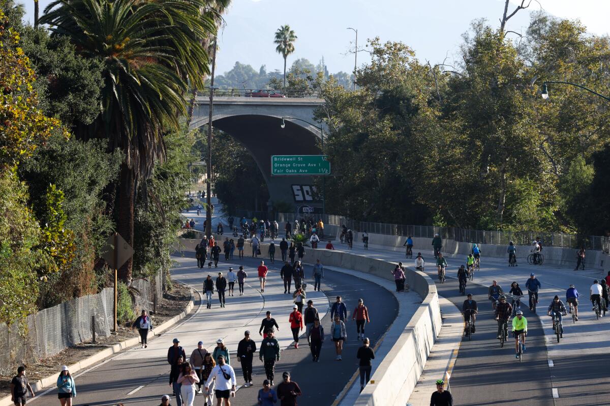 People walk and bike at ArroyoFest on Sunday in Los Angeles.