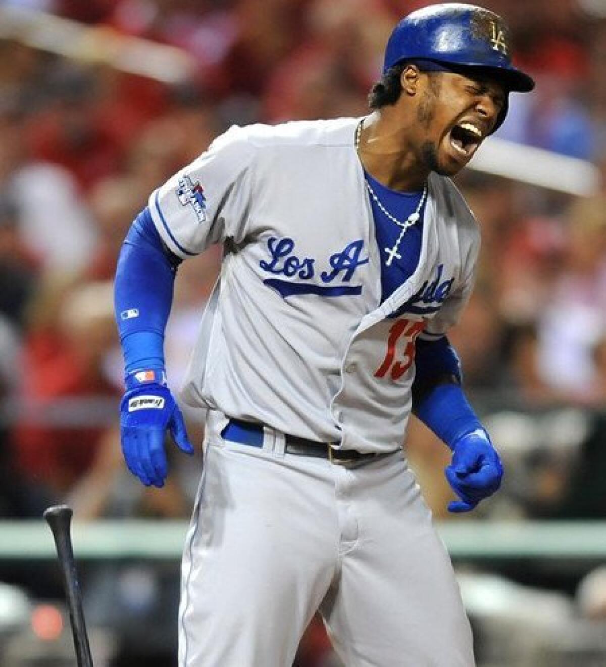 Dodgers shortstop Hanley Ramirez reacts after getting hit in the ribs by a pitch in the first inning.