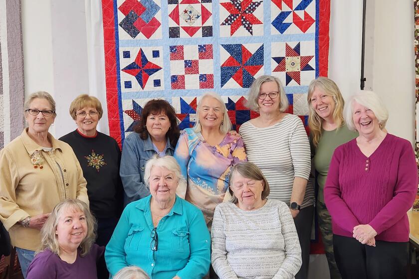 Ramona Backcountry Quilters display a patriotic quilt they are making for the Ramona VFW Post 3783. 